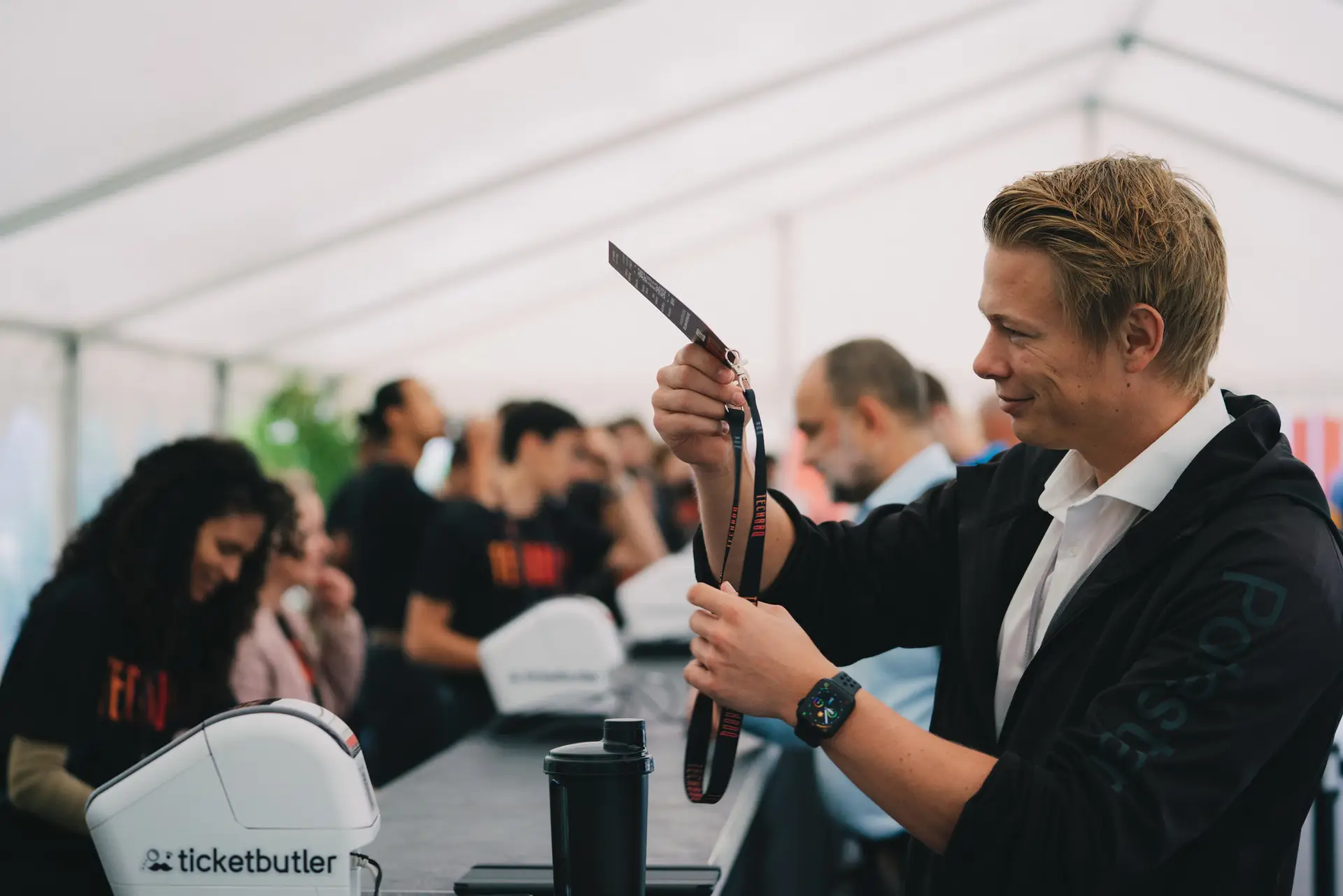 Volunteers preparing badges at a TechBBQ check-in desk